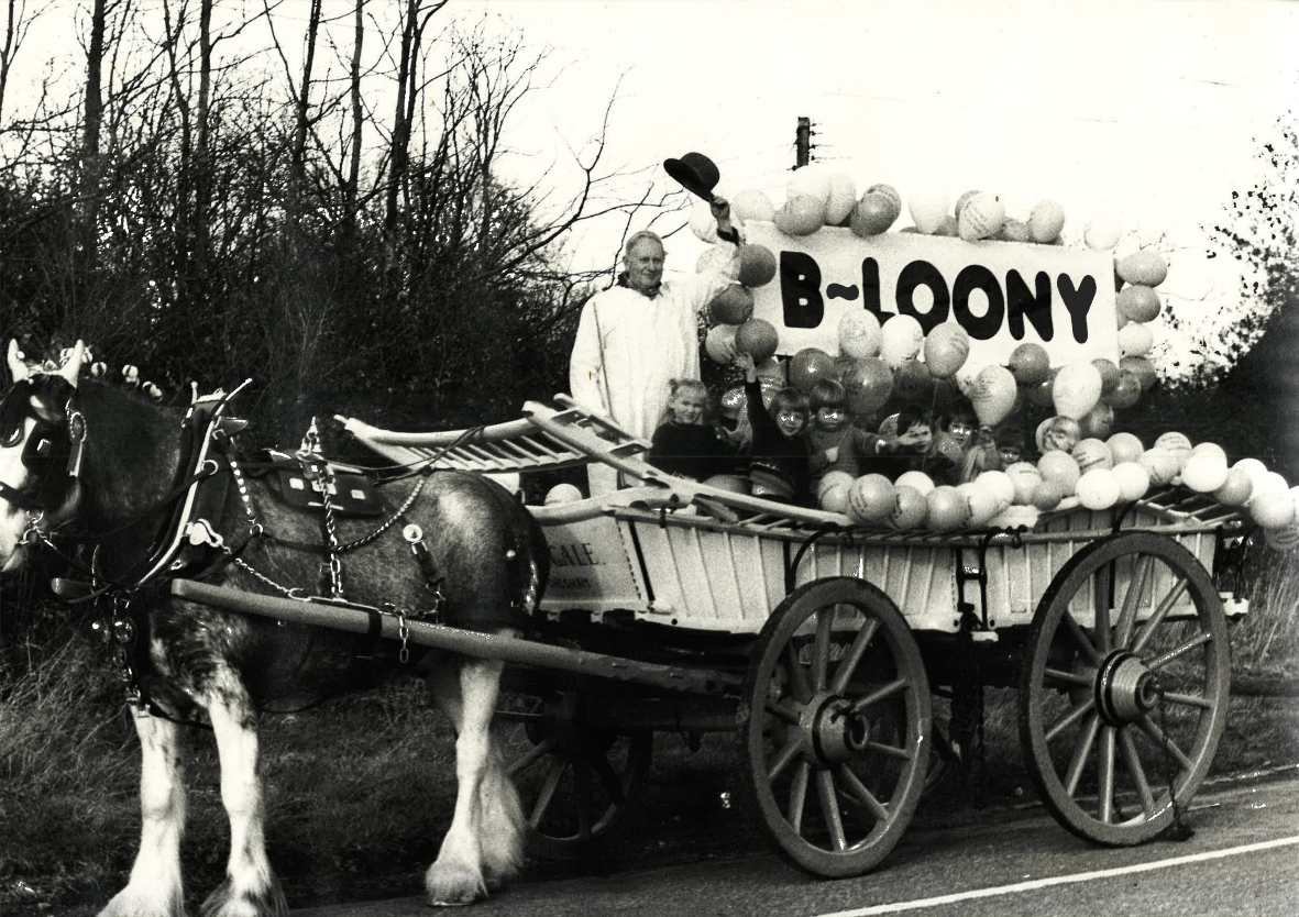 Balloons and Children on a Horse and Cart with a B-Loony sign