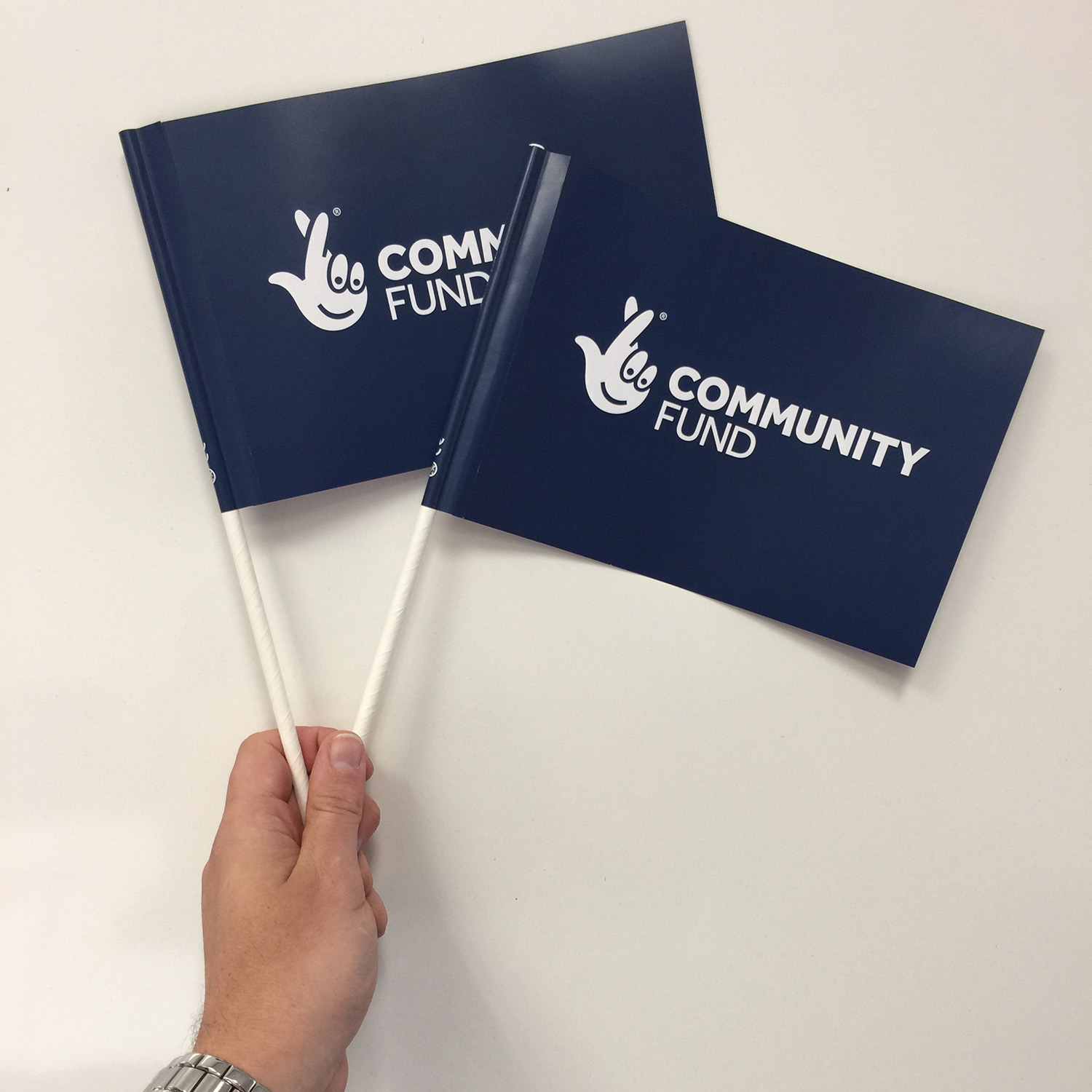 a5-handheld-flag-lottery-community-fund