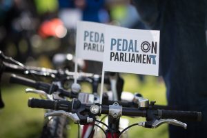 Pedal on Parliament Hand Waving Flags